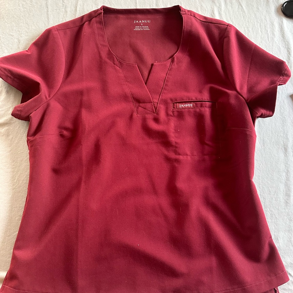 Like new Burgundy Jaanuu scrub top, large